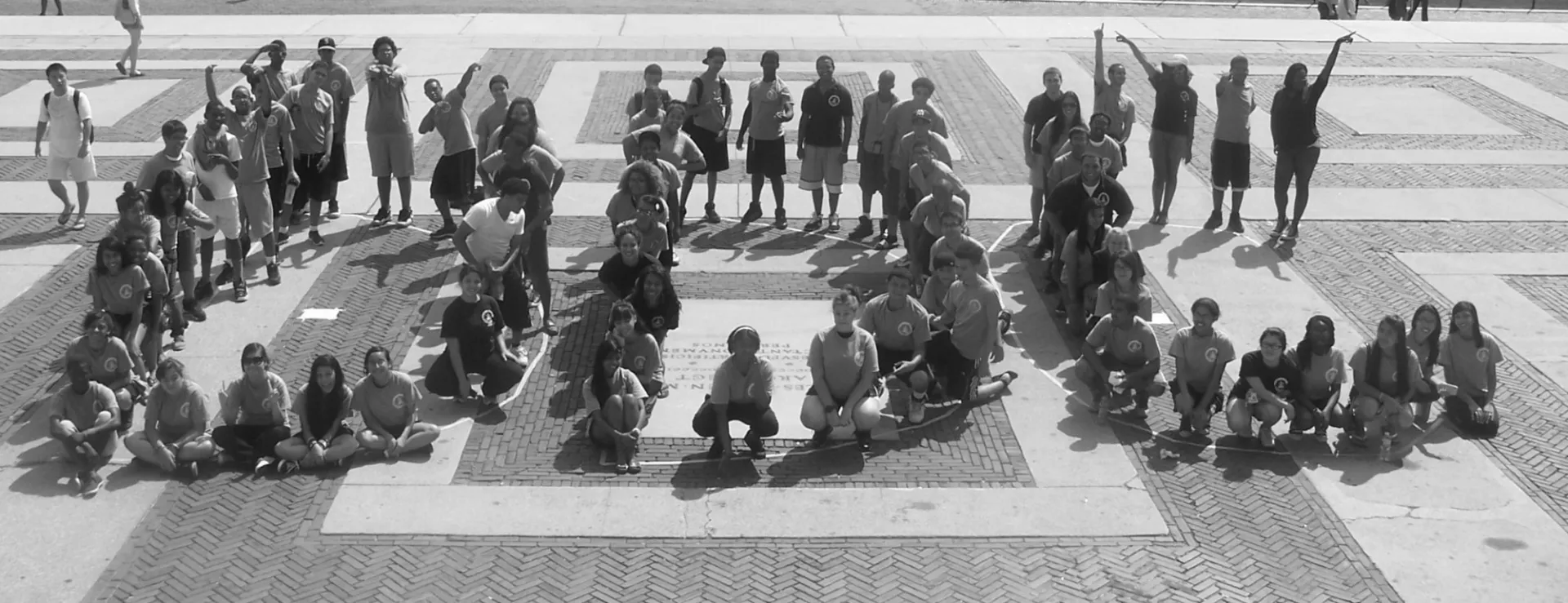 Students assembled on Low Plaza to create this photo in honor of the program’s name change to Double Discovery Center.