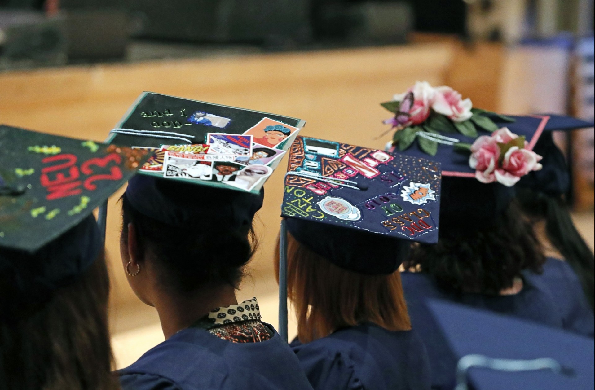 DDC graduates wearing graduation caps